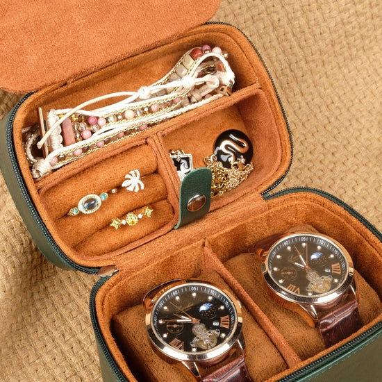 Open jewelry case with watches and accessories on a beige background